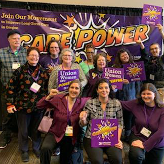 Homecare workers in front of Care Power banner